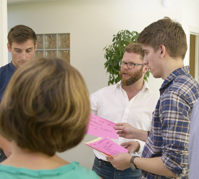 group of people in stand up meeting