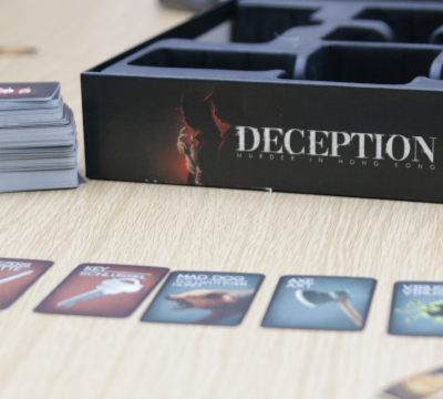 board game box and cards on table