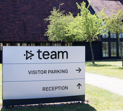 team consulting car park sign