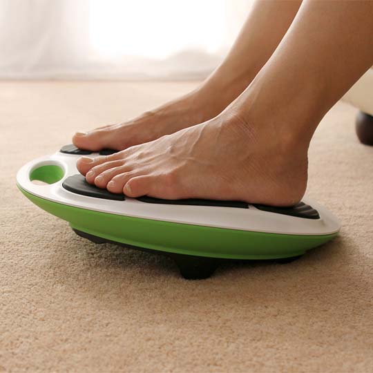 close up of bare feet on revitive device