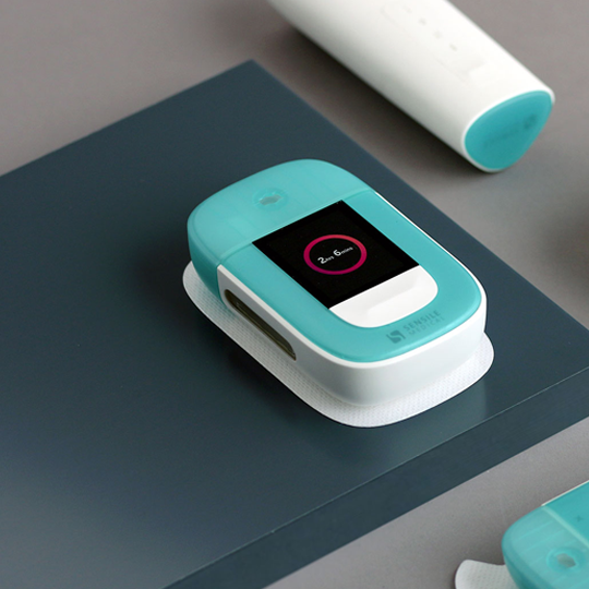 range of injector devices displayed on a table